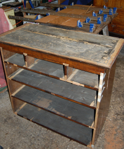 Chest stripped down and broken pieces being repaired
